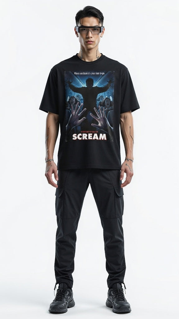Person wearing a black 'Scream' t-shirt with graphic design on a white background